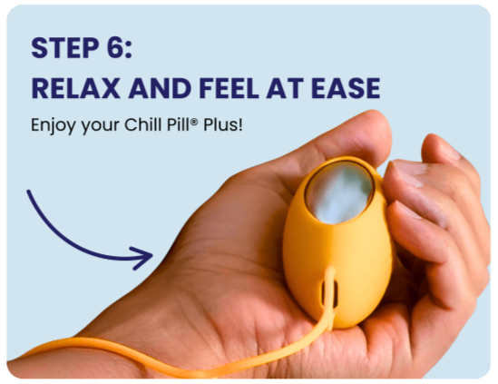 Hand holding the Chill Pill Plus
