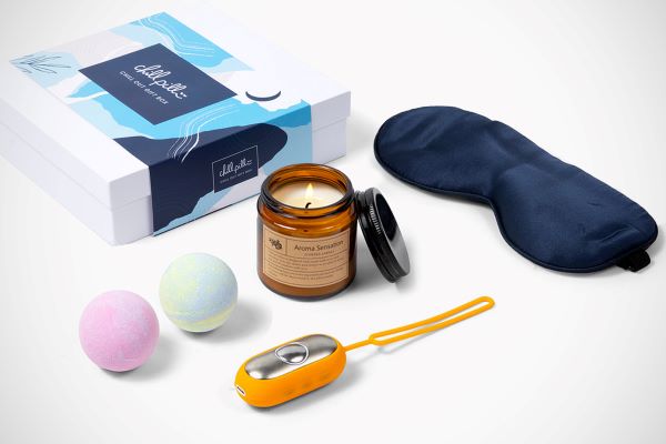 Overview of The Chill Pill and Unwind Gift Box contents, including sleep mask, aroma candle, and bath bombs