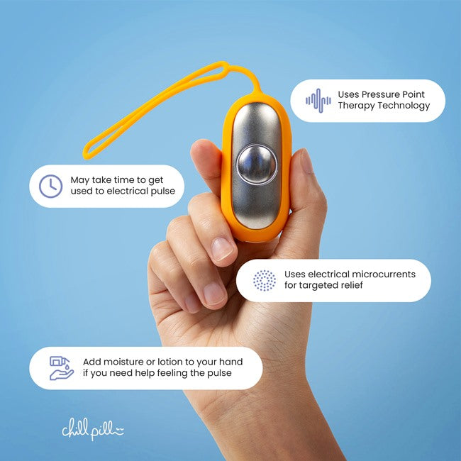 Hand holding The Chill Pill with annotations on pressure point therapy and microcurrent usage for pain relief.