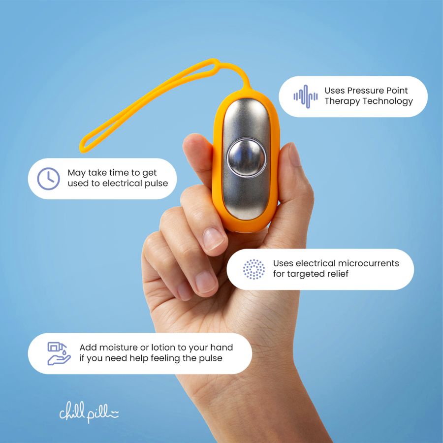 Hand holding The Chill Pill with annotations on pressure point therapy and microcurrent usage for pain relief.