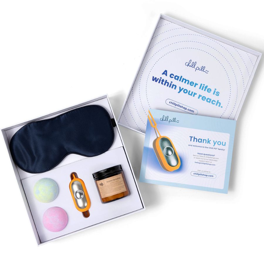 The Chill Pill and Unwind Gift Box fully opened showing all components for relaxation.