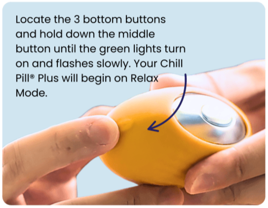 Thumbs positioned over the middle button to set The Chill Pill Plus into Relax mode.