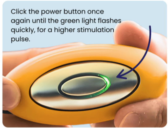 Fingers holding the Chill Pill Plus, with the power button flashing green for a higher stimulation pulse